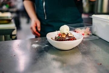 chef cooking dessert in the kitchen