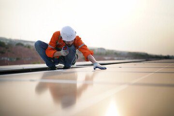 Fototapeta premium professional technician or engineer installing solar panels, Alternative energy for installed solar panels in use on roof of home
