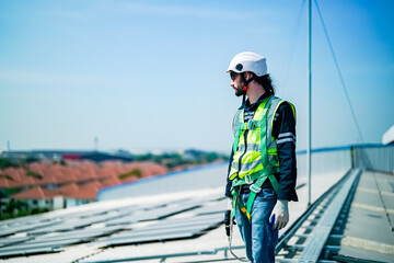 professional technician or engineer installing solar panels, Alternative energy for installed solar panels in use on roof of home