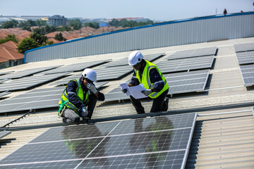 professional technician or engineer installing solar panels, Alternative energy for installed solar panels in use on roof of home