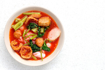 A bowl of pink flat noodles
