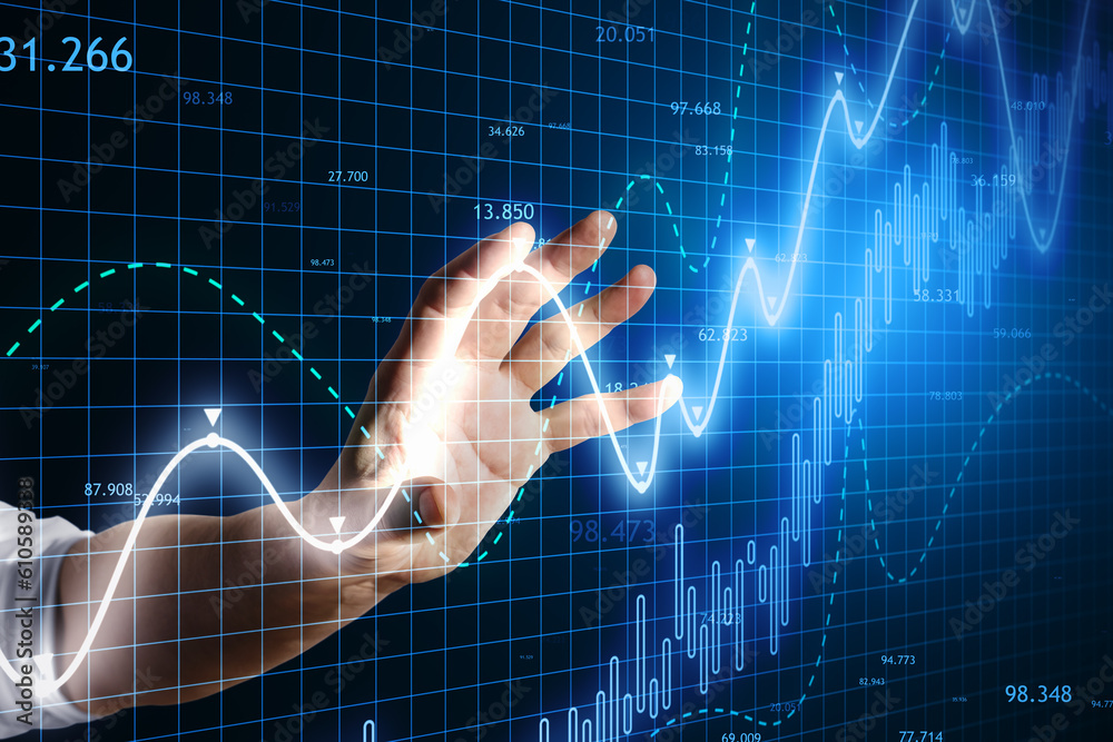 Poster close up of man hand using glowing candlestick forex chart on blue grid background.