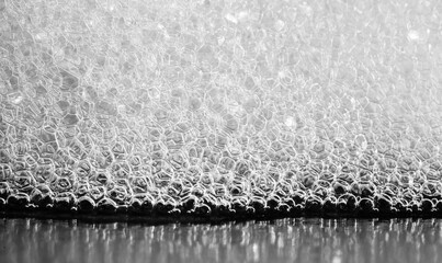 Soap foam close-up. thousands of shampoo suds bubbles at macro zoom