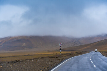  the road, mountain and cloud sky at Tanglang La pass in Ladakh, India, is the second highest...