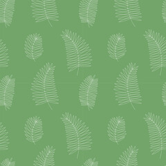 Vector palm tree leaves seamess pattern. Hand drawn palm leaves on green background