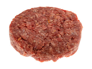 Side view of a thick gourmet hamburger patty isolated on a white background.