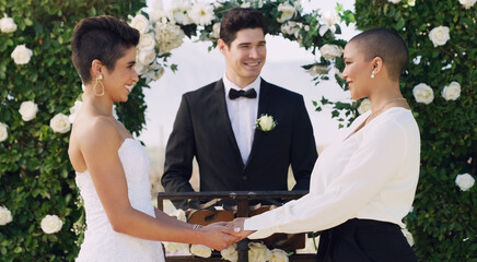 Love, holding hands and gay with lesbian couple at wedding for celebration, lgbtq and pride. Smile, spring and happiness with women at event in garden for partner commitment, queer and freedom - obrazy, fototapety, plakaty