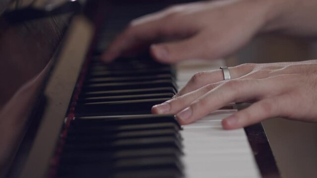 unrecognizable hands playing the instrument