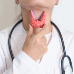 Doctor with human Thyroid anatomy model. Hyperthyroidism, Hypothyroidism, Hashimoto Thyroiditis,...