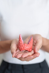 Woman holding human Thyroid anatomy model. Hyperthyroidism, Hypothyroidism, Hashimoto Thyroiditis,...