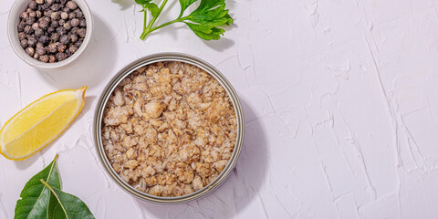 Tinned fish tuna in oil with spices and herbs. Healthy ingredient for vegetarian lifestyle. Seafood