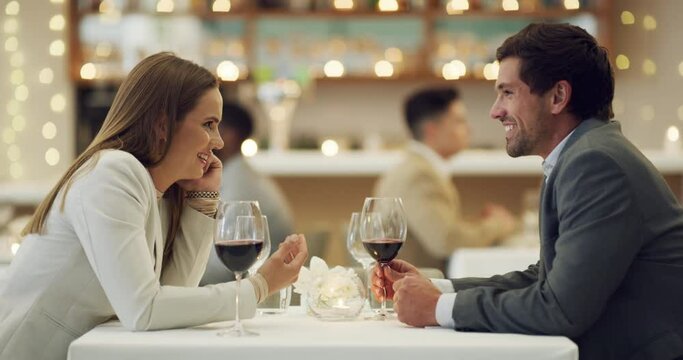 Laughing, talking or happy couple in restaurant in celebration of marriage anniversary at dinner at night. Funny joke, romantic man or lovely woman fine dining, speaking or bonding on fancy wine date