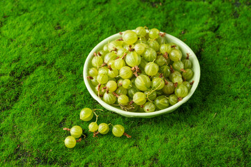 Fresh small sour berries on a natural green background