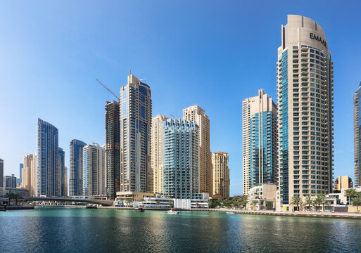 Dubai, UAE, January 11 2023: Luxury Dubai Marina canal and promenade in beautiful summer day,Dubai,United Arab Emirates