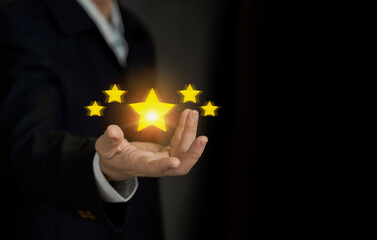 Businessman hand show five star symbol on his hand lto increase rating of products and services concept, Customer service and business satisfaction survey,selective focus.