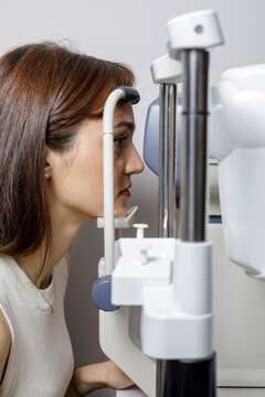 side view of a woman in front of the eye test