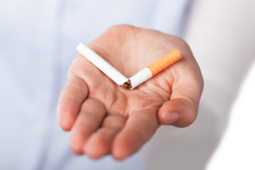 A woman breaking a cigarette, Stop smoking concept