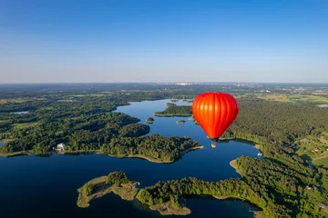 Foto op Aluminium Aerial summer sunny sunset view of hot air balloon over Galve lake, Lithuania © Top Lithuania