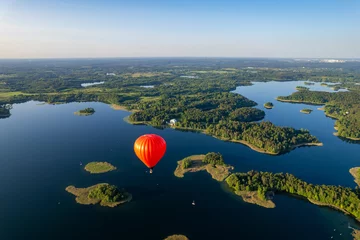 Poster Aerial summer sunny sunset view of hot air balloon over Galve lake, Lithuania © Top Lithuania