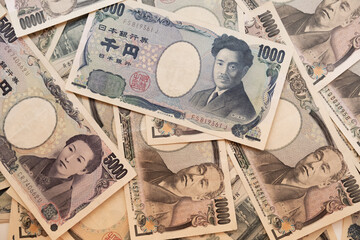 Stack of banknotes of different amounts of Japanese yen. Money concept.