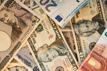 Euro, dollar and yen banknotes stacker. Money concept.