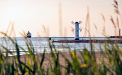 Panoramic image of an old lighthouse in Swinoujscie, a port in Poland on the Baltic Sea.