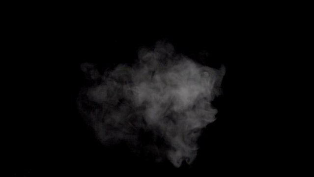 White smoke,steam on a black background.  Top-Down Angle. Slow motion. Shot in 4K resolution at 120fps.