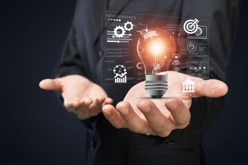 Businessman hand holding light bulb for ideas concept