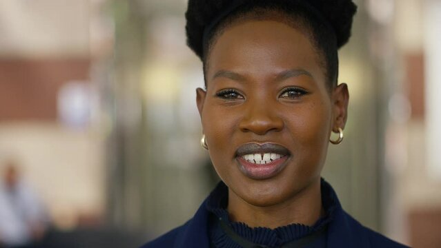 Young black female talking to camera in an interview style