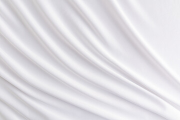 Luxurious wedding textiles. satin white delicate background. soft folds of satin fabric. Abstract background for design.