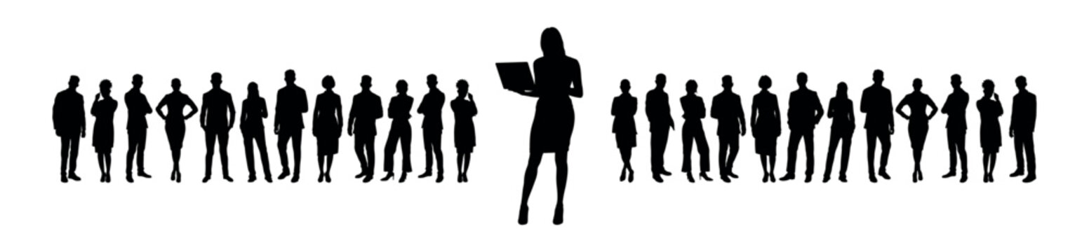 Businesswoman standing and holding laptop in front of large group of business people silhouette.