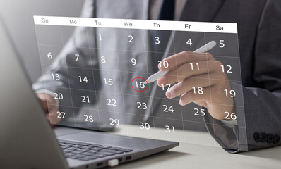 Businessperson or secretary manages time for effective work. Calendar on the virtual screen interface. Highlight appointment reminders and meeting agenda on the calendar. Time management concept..