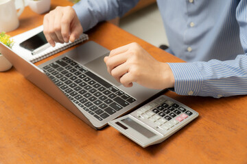 businessman hand's hand on the tray can hold a Notebook, Mobile, and Notepad which has some essentials that are sufficiently necessary for gadgets needed for mobile communication and online access.