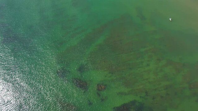 Compton Beach, Isle of Wight, UK 2023 - Flying along the beach panning up from shallow water