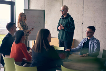 In a modern office setting, a group of business professionals attentively listens to a captivating...