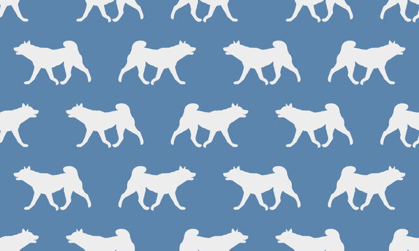 Dog silhouette. Walking american akita puppy isolated on a blue background. Seamless pattern. Endless texture. Design for wallpaper, fabric, template, printing. Vector illustration.