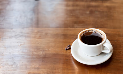 a cup of coffee and coffee beans on the wooden table in the warm cafe beside the window. coffee restaurant concept design mood. Ai illustration generator. top view copy space. wooden floor. close up