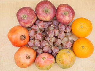 Naklejka na ściany i meble Fruits Decoration,overhead view, apples ,oranges ,pomegranate,mango,grapes
