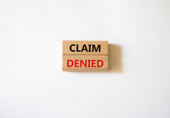 Claim denied symbol. Wooden blocks with words Claim denied. Beautiful white background. Business and Claim denied concept. Copy space.