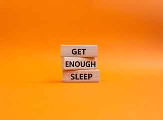 Get enough sleep symbol. Wooden blocks with words Get enough sleep. Beautiful orange background. Healthy lifestyle, medical and Get enough sleep concept. Copy space.