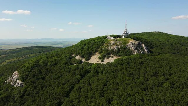 Drone is flying around the Pyramid Radio tower on top of Zobor Mountain, 4k