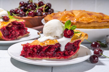 Homemade sweet cherry cake with vanilla ice cream ball. Slice of cherry pie topped with scoop of melting ice cream