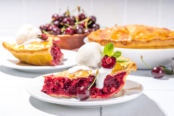 Homemade sweet cherry cake with vanilla ice cream ball. Slice of cherry pie topped with scoop of melting ice cream