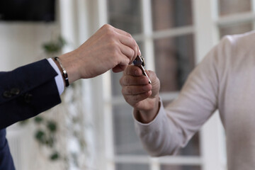 New owner of residence gets key to purchased property in office. Architecture and design suitable...
