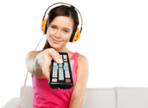Woman Wearing Headphones and Using a Remote Control