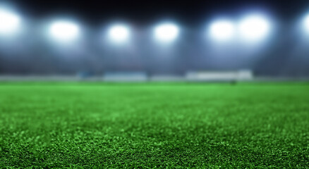 beautiful soccer field grass with defocused background with bokeh lights