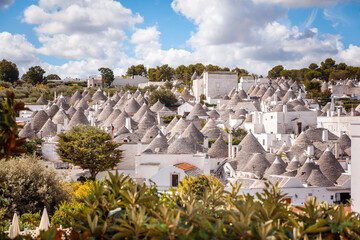 Panoramic view of Rione Monti (Monti quarter), Alberobello, Bari, Italy. The quarter stretches south of the city center and counts about one thousand trulli houses. - obrazy, fototapety, plakaty