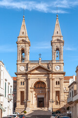 Fototapeta na wymiar Facade of Santi Medici Church, Alberobello, Bari, Italy