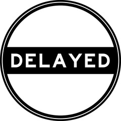 Black color round seal sticker in word delayed on white background