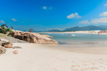 Fototapeta na wymiar Beach with sand and ocean on a sunny day. Holiday beach in Brazil, Florianopolis